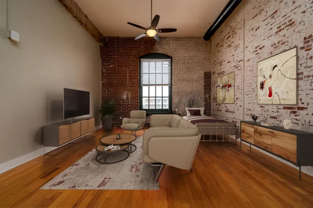 a living room with furniture and a flat screen tv