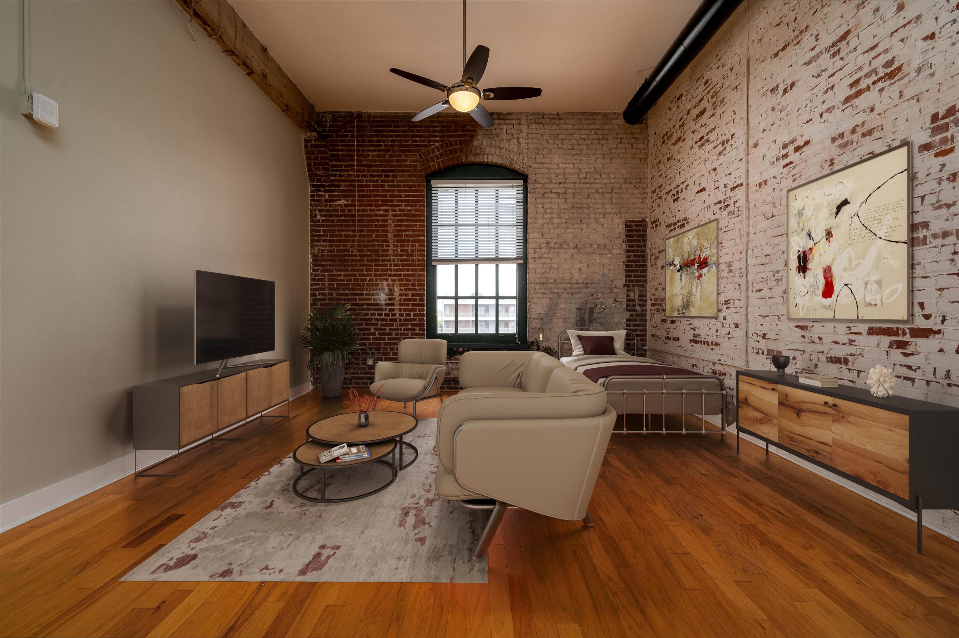a living room with furniture and a flat screen tv
