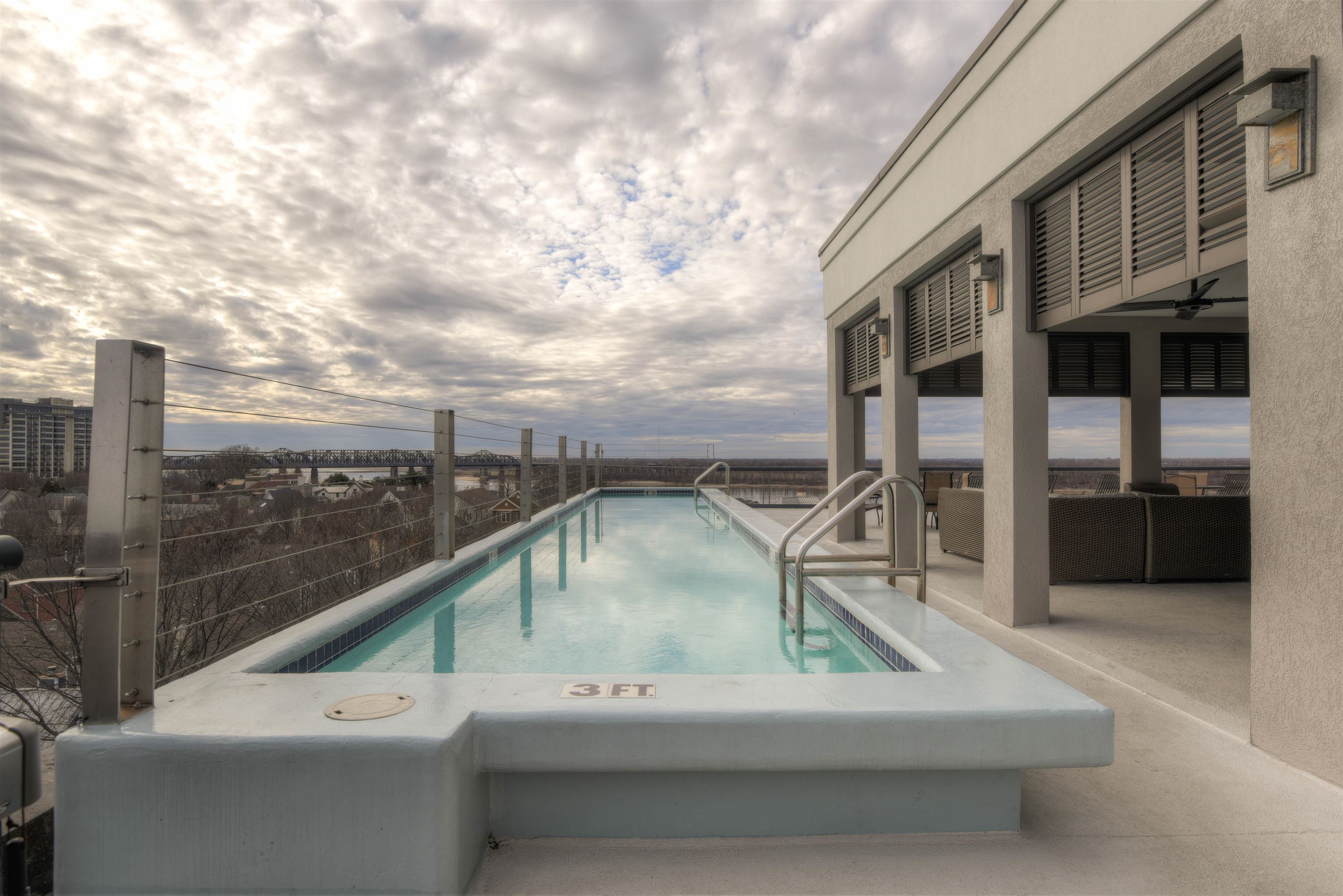 505 Tennessee Street, Unit 407 Memphis, TN 38103 - Photo 23 of 27 a roof deck with table and chairs