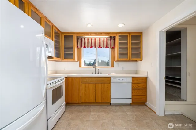 a kitchen with stainless steel appliances granite countertop a stove and a sink