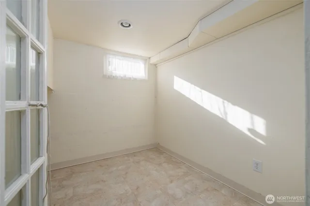 a view of empty room with windows