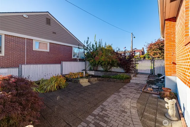 a view of a backyard with sitting area