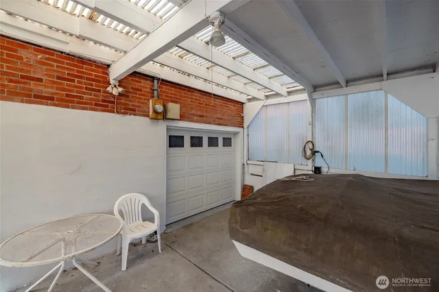 a bed room with a bed and chair