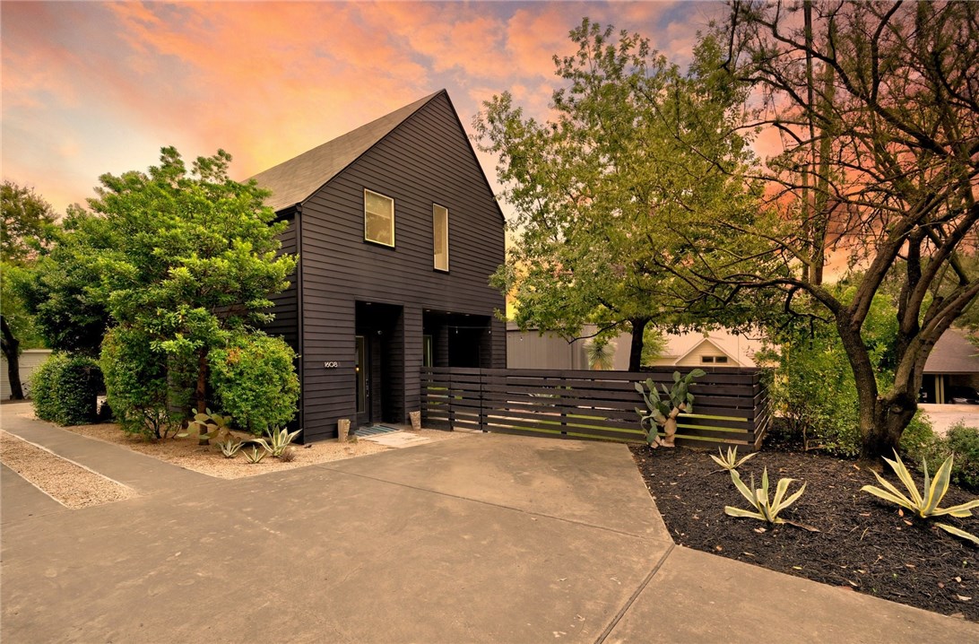 1608 Ravey Street, Unit A Austin, TX 78704 - Photo 1 of 1 a front view of a house with a yard