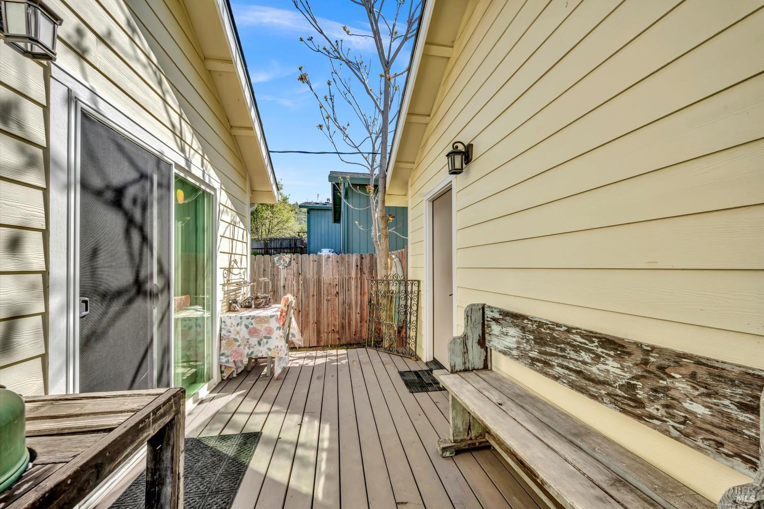 15314 Summit Boulevard Cobb, CA 95426 - Photo 16 of 29 a view of a balcony with wooden floor and iron fence