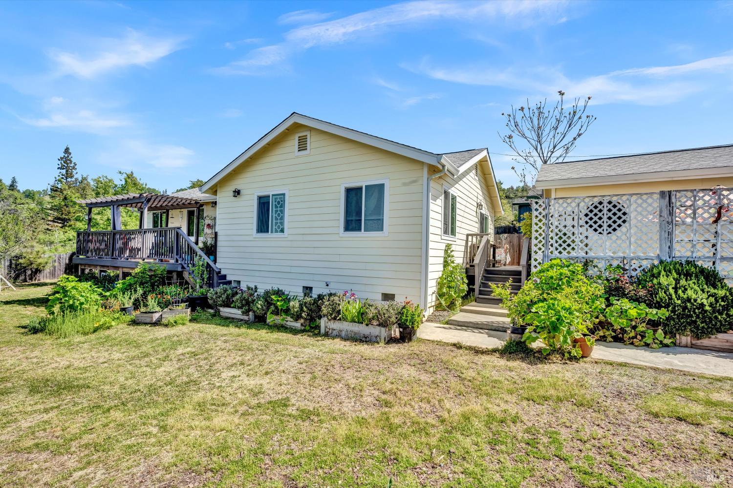 15314 Summit Boulevard Cobb, CA 95426 - Photo 19 of 29 a front view of a house with a yard