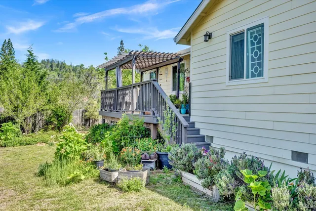 a view of a house with a flower garden