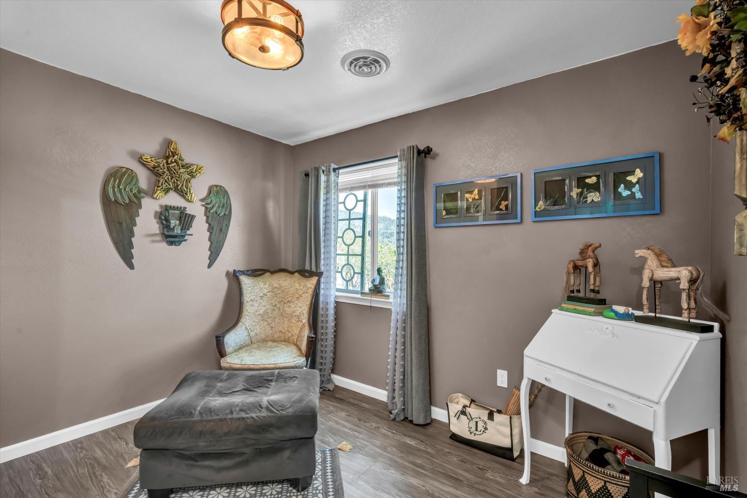 15314 Summit Boulevard Cobb, CA 95426 - Photo 10 of 29 a living room with furniture and a window