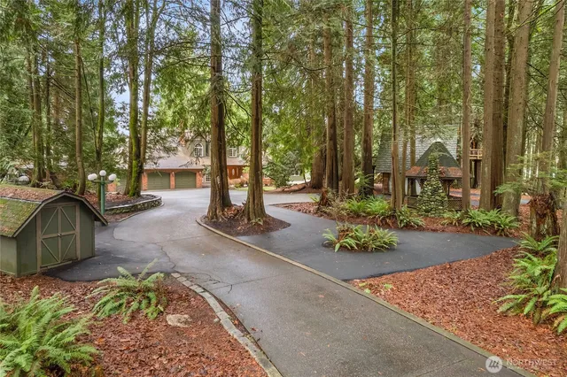 front view of a house with a tree