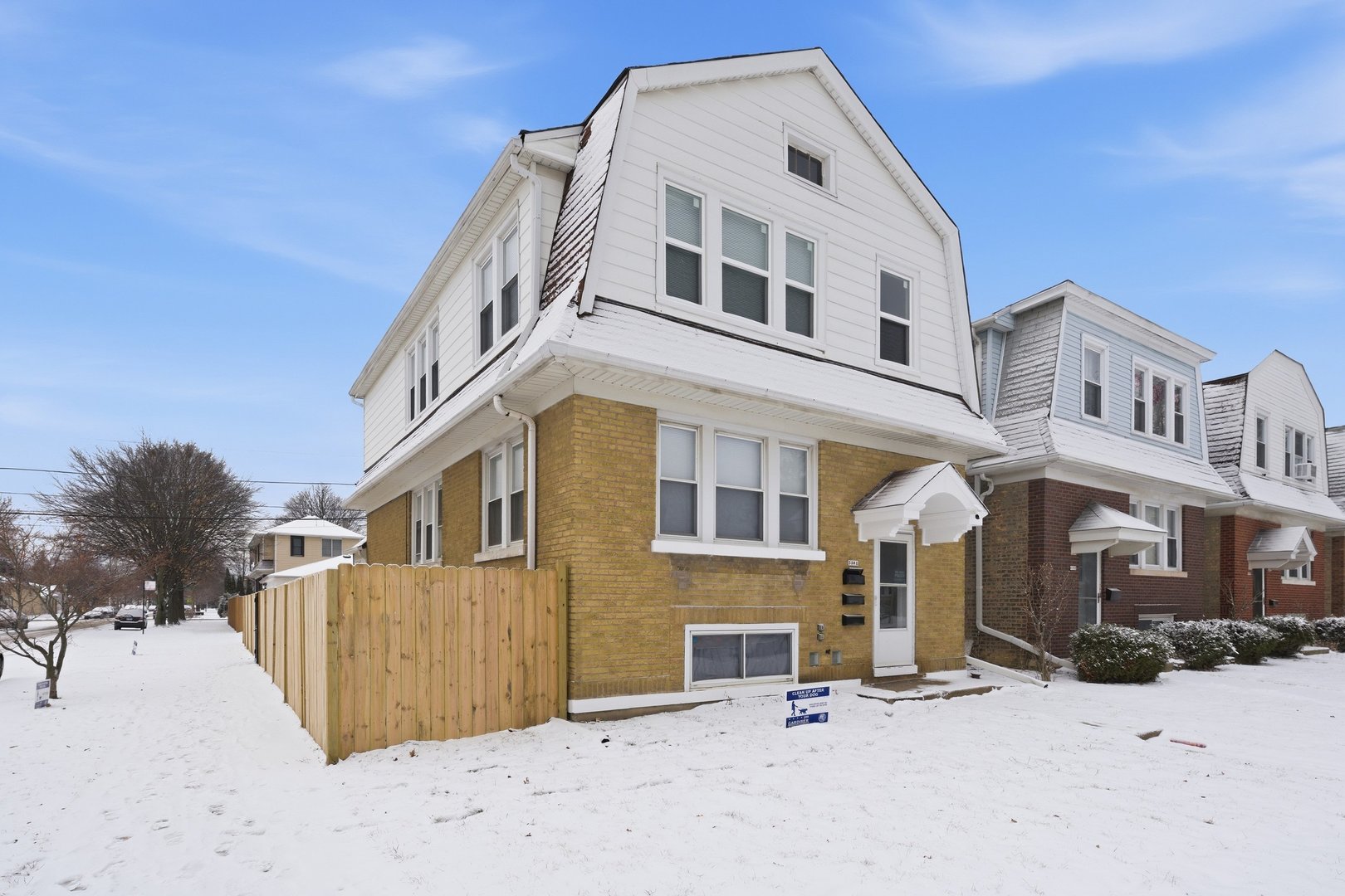 5301 West Winona Street, Unit 2 Chicago, IL 60630 - Photo 10 of 11 a front view of a building with a yard