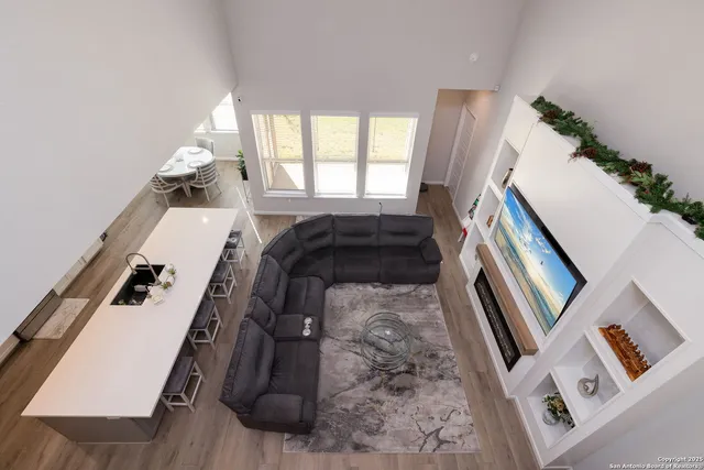 a view of living room with furniture and a fireplace