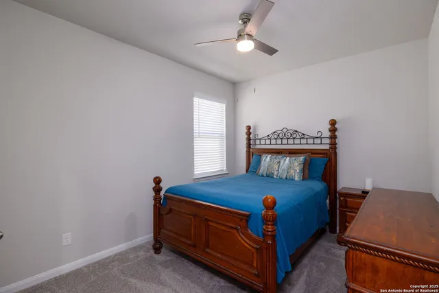 a bathroom with a double vanity sink mirror and shower
