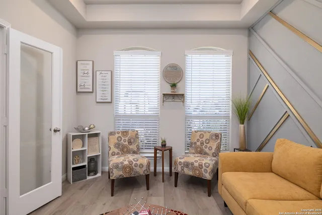 a living room with furniture and a window