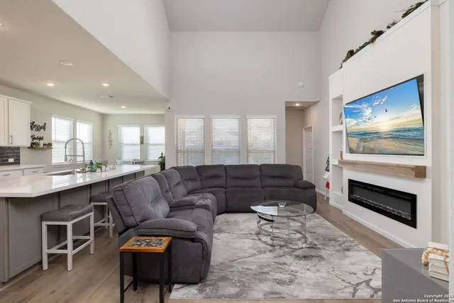 a living room with furniture and a fireplace