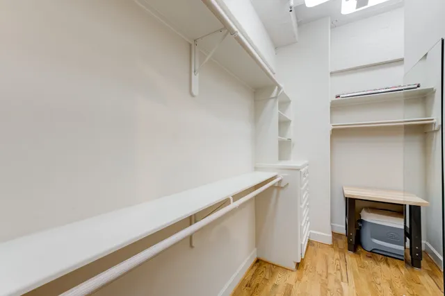 a room with a fireplace and wooden floor
