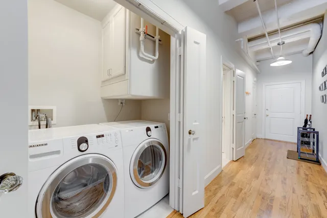 a view of a hallway with washer and dryer