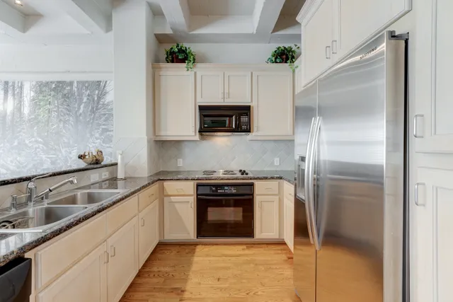 a kitchen with a sink and a refrigerator
