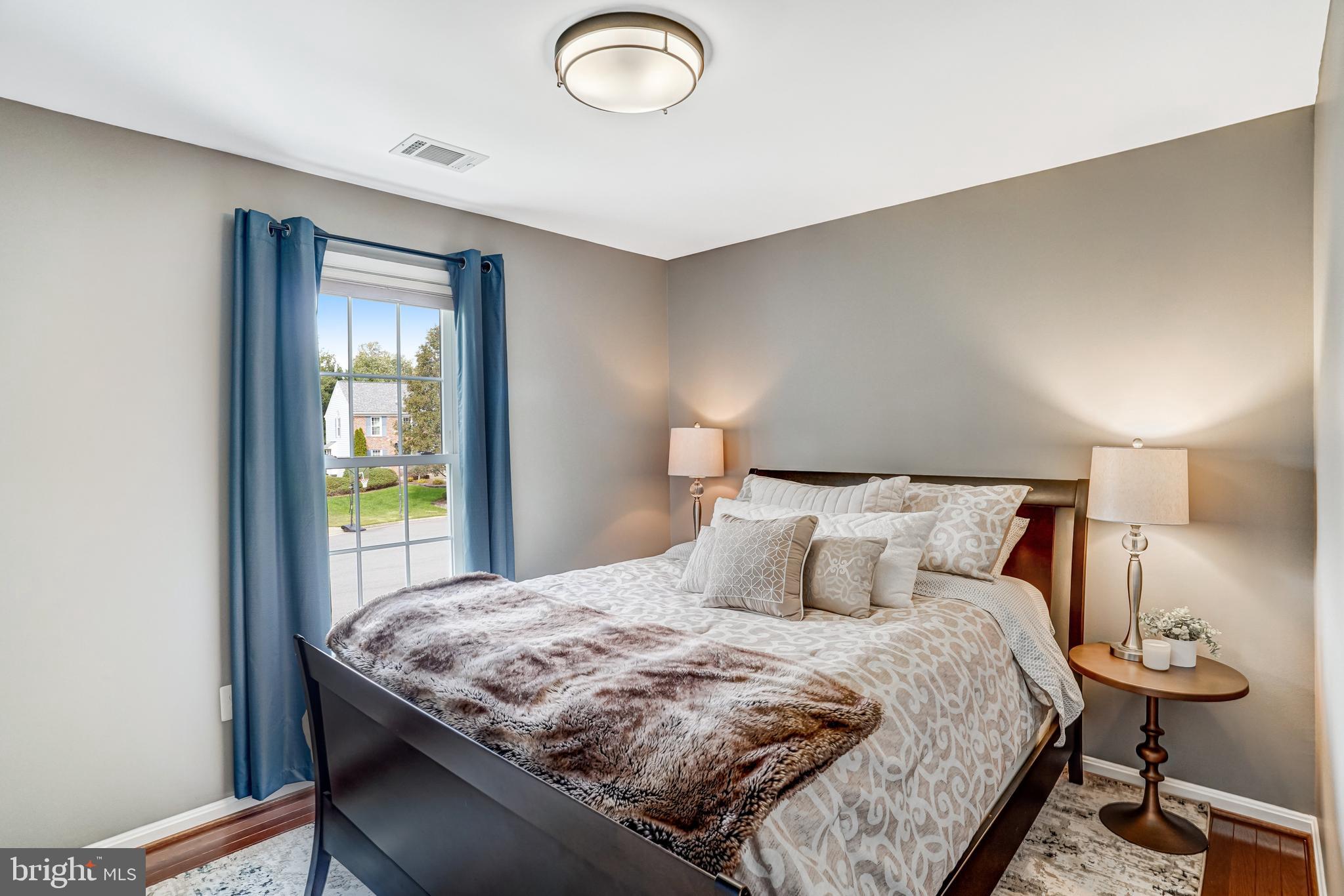 9009 Digory Court Burke, VA 22015 - Photo 12 of 51 a bedroom with a bed and a lamp next to a window