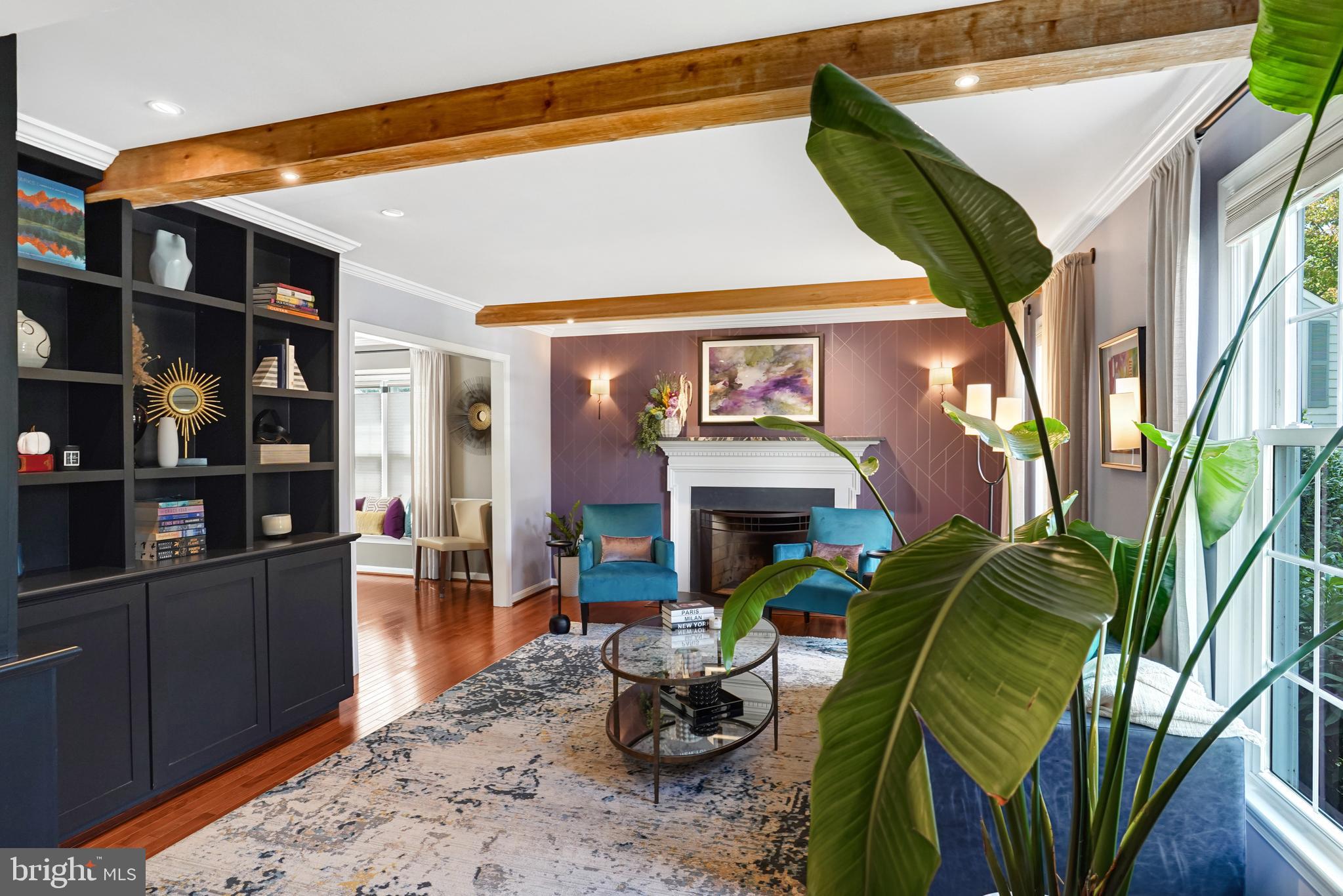 9009 Digory Court Burke, VA 22015 - Photo 20 of 51 a living room with fireplace furniture and a wooden floor