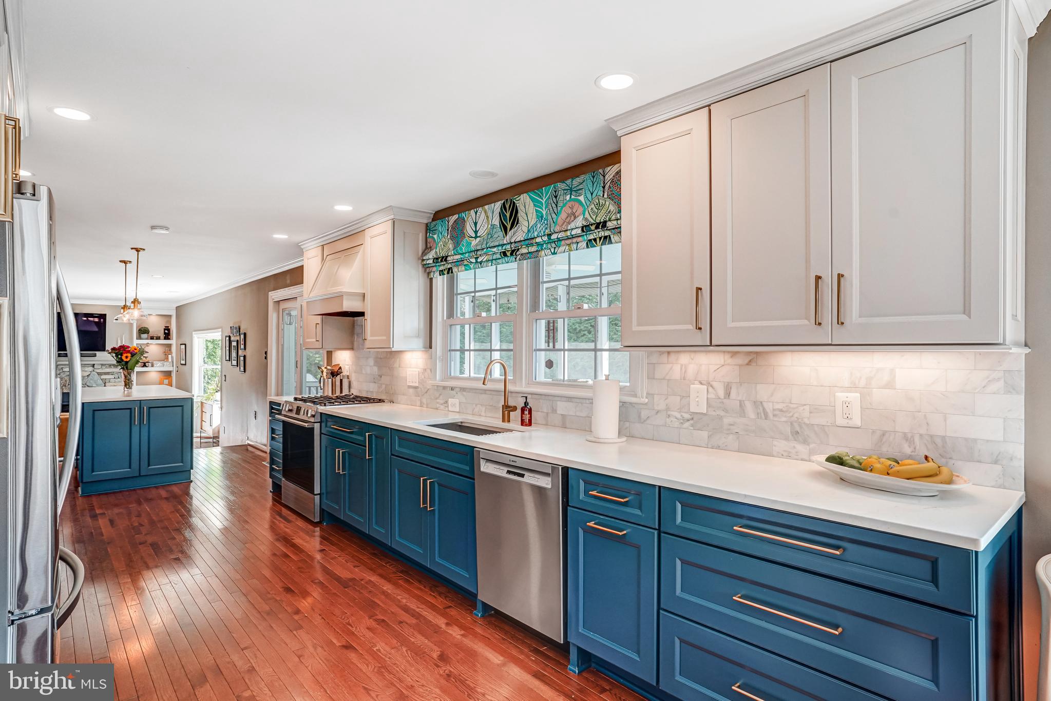 9009 Digory Court Burke, VA 22015 - Photo 25 of 51 a kitchen with stainless steel appliances granite countertop a sink a stove and cabinets