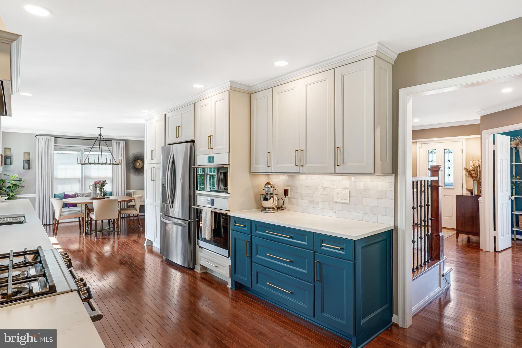 9009 Digory Court Burke, VA 22015 - Photo 27 of 51 a kitchen with stainless steel appliances granite countertop a refrigerator and a stove top oven