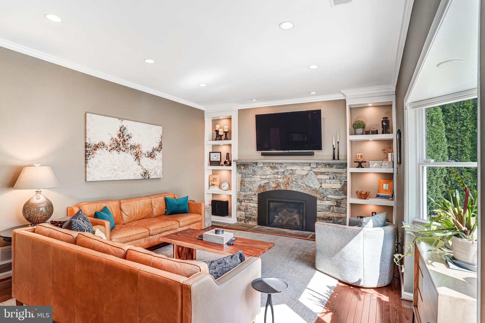 9009 Digory Court Burke, VA 22015 - Photo 31 of 51 a living room with furniture fireplace and a flat screen tv