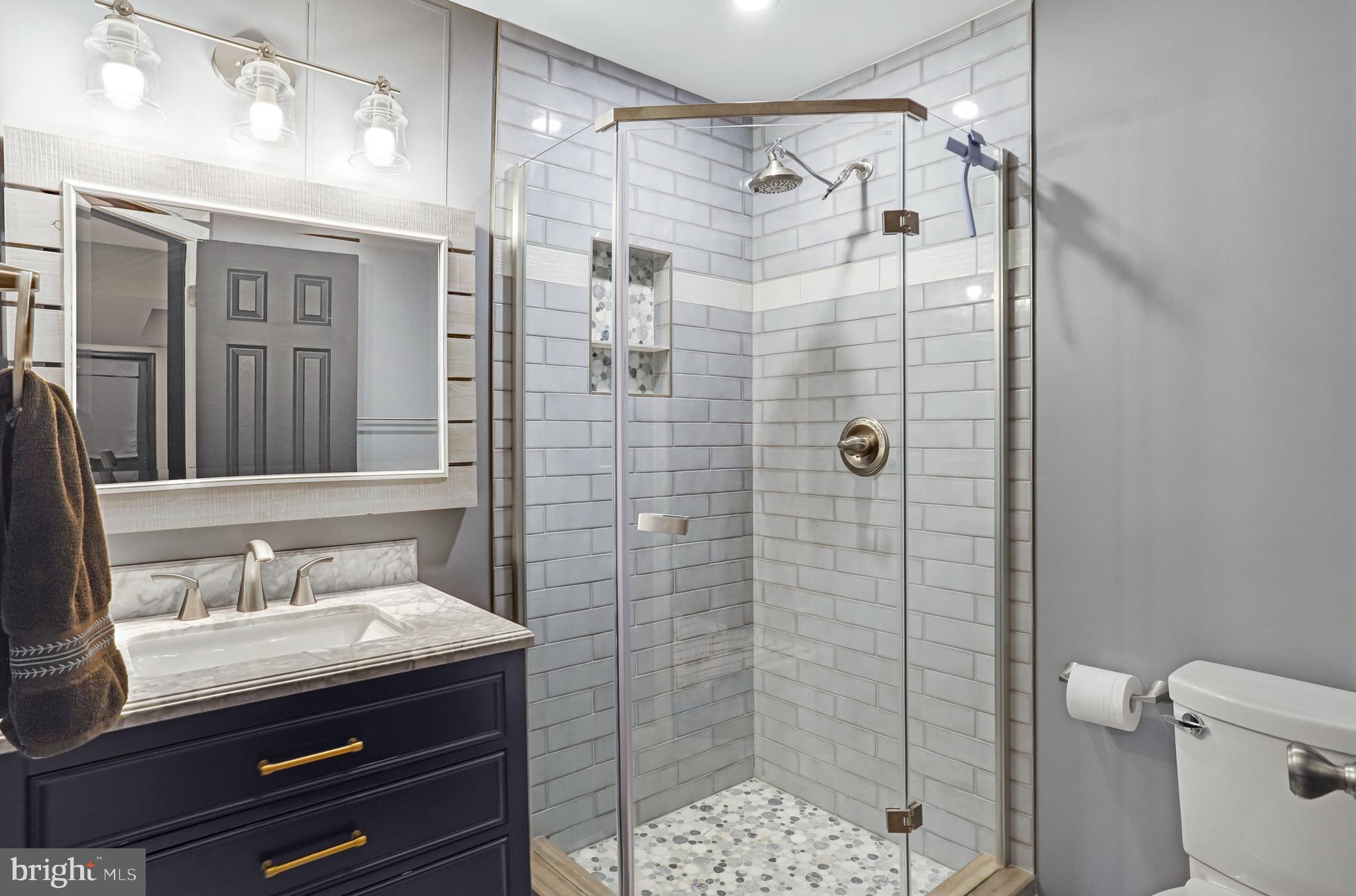 9009 Digory Court Burke, VA 22015 - Photo 35 of 51 a bathroom with a granite countertop shower sink vanity and toilet