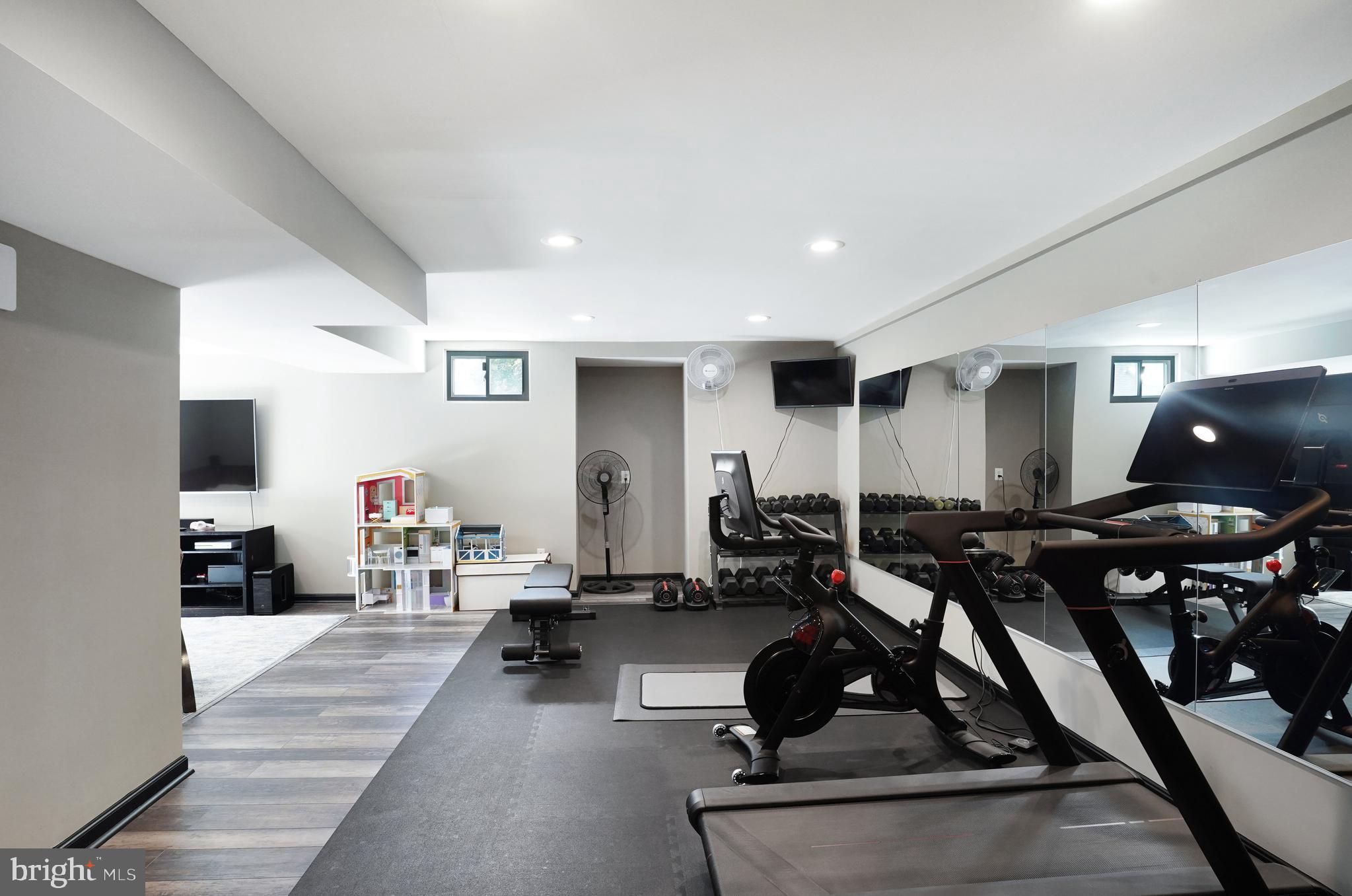 9009 Digory Court Burke, VA 22015 - Photo 36 of 51 a living room with furniture gym equipment and a view of living room