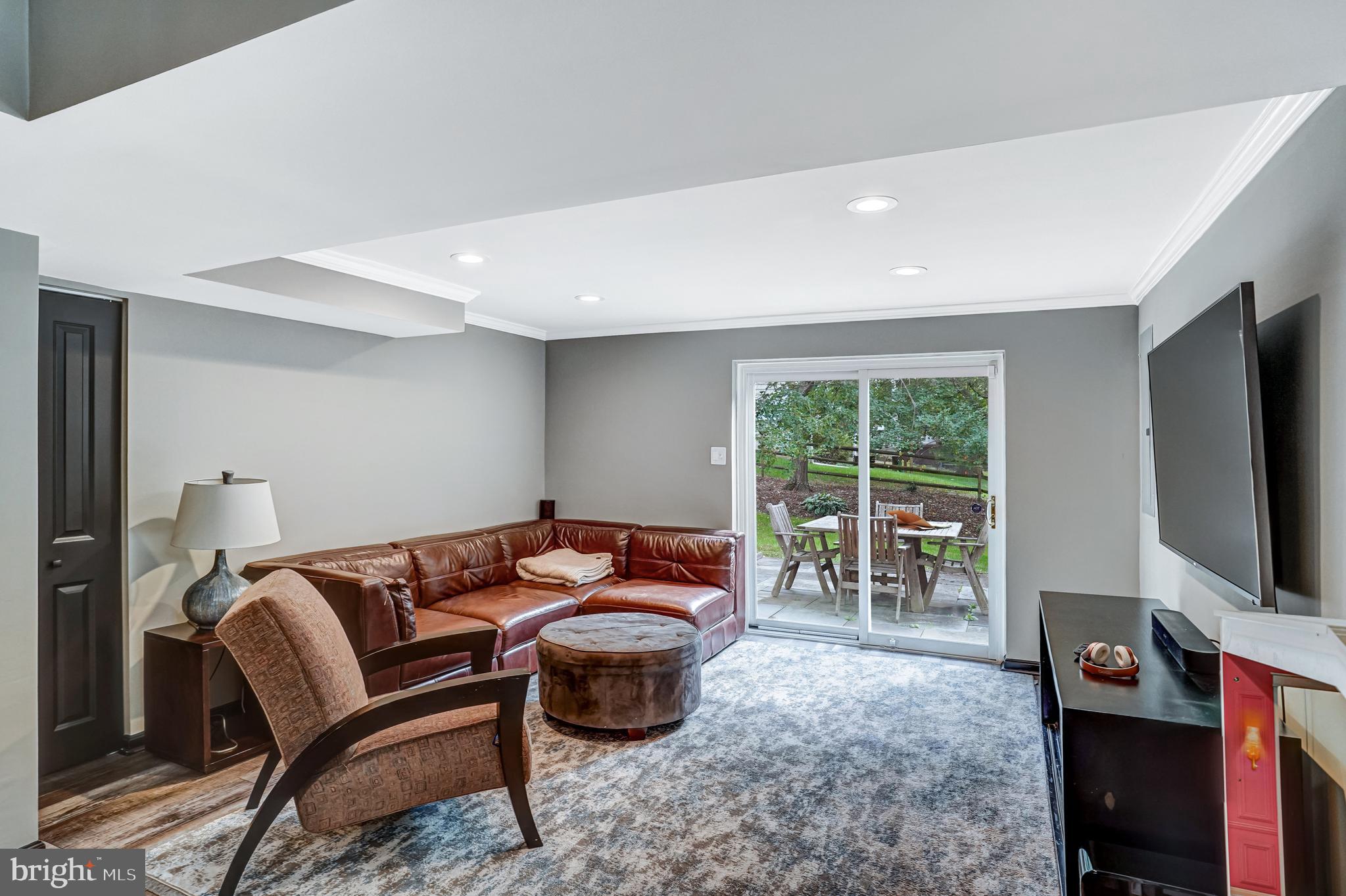 9009 Digory Court Burke, VA 22015 - Photo 39 of 51 a living room with furniture and a flat screen tv