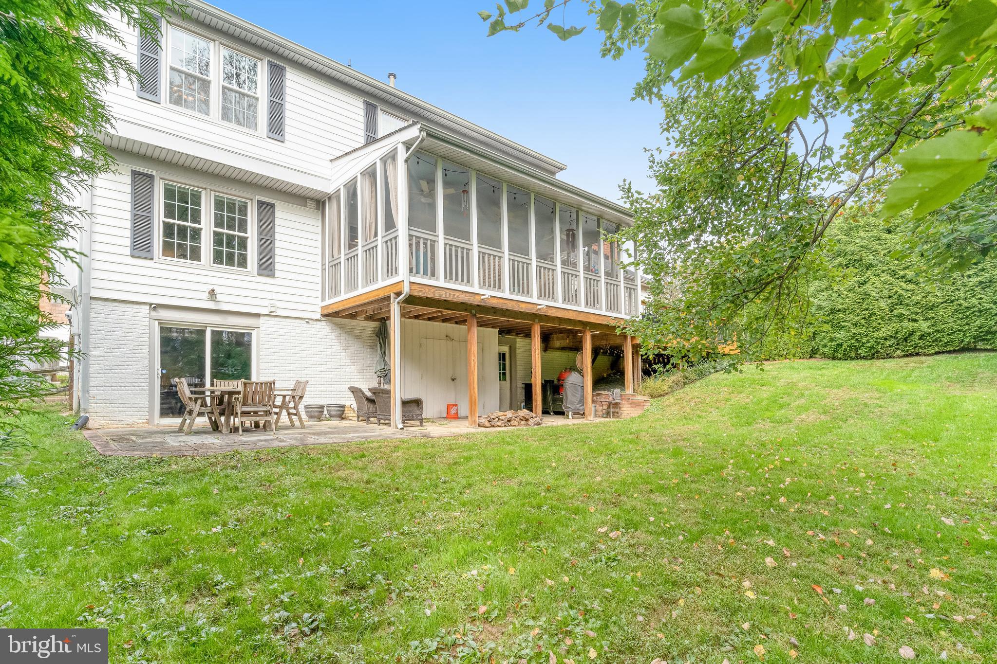 9009 Digory Court Burke, VA 22015 - Photo 46 of 51 a front view of house with yard and seating area