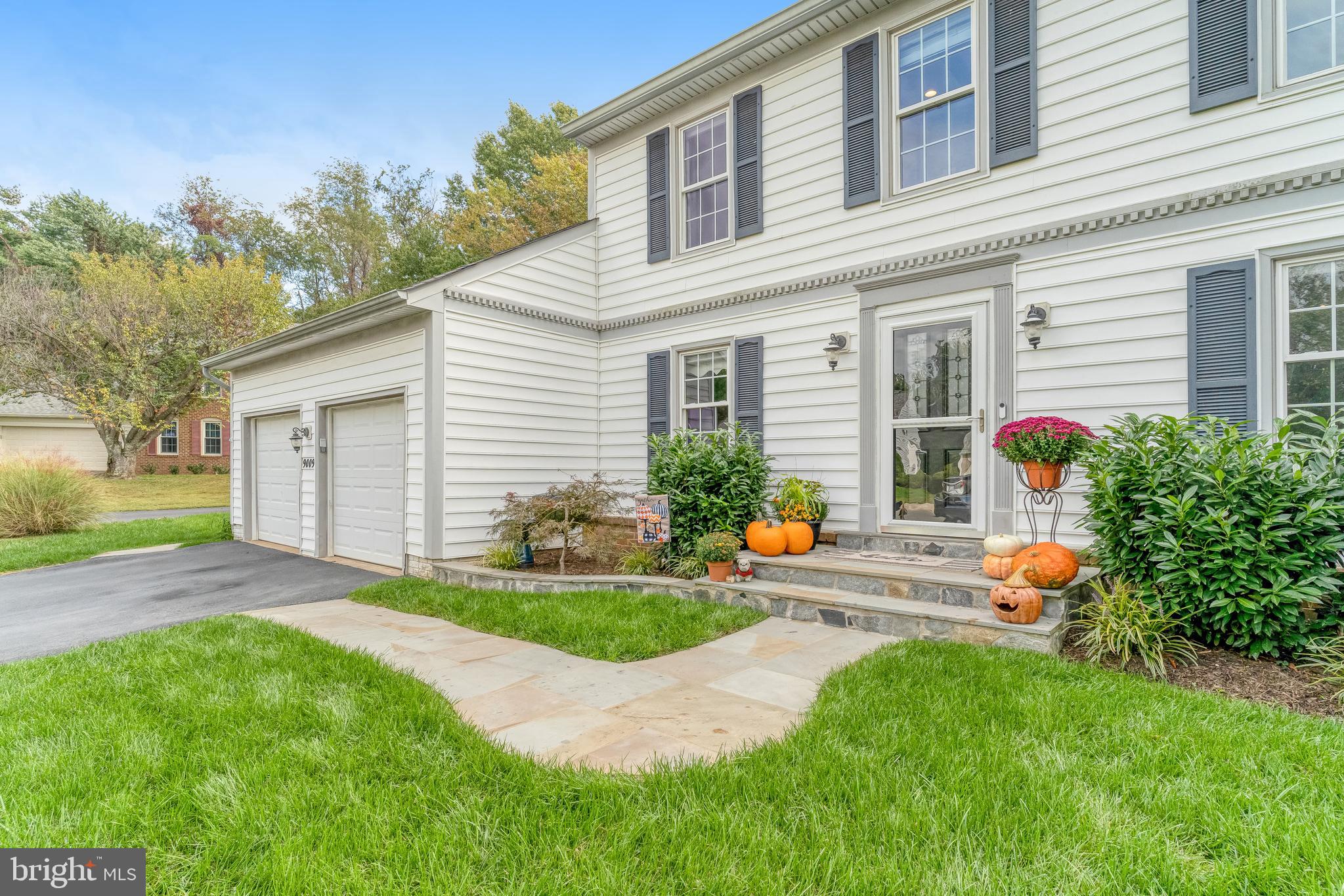 9009 Digory Court Burke, VA 22015 - Photo 49 of 51 a front view of house with yard and outdoor seating