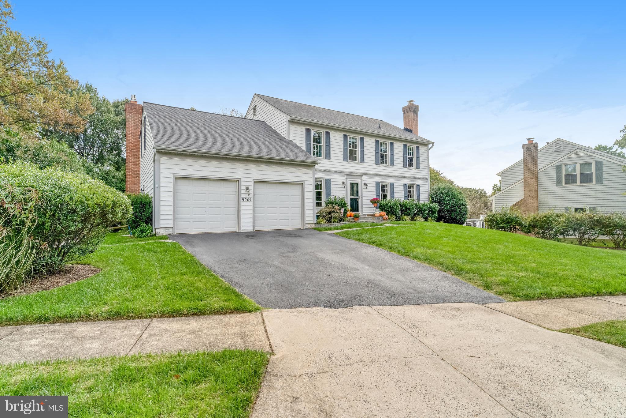 9009 Digory Court Burke, VA 22015 - Photo 51 of 51 a front view of house with yard and green space