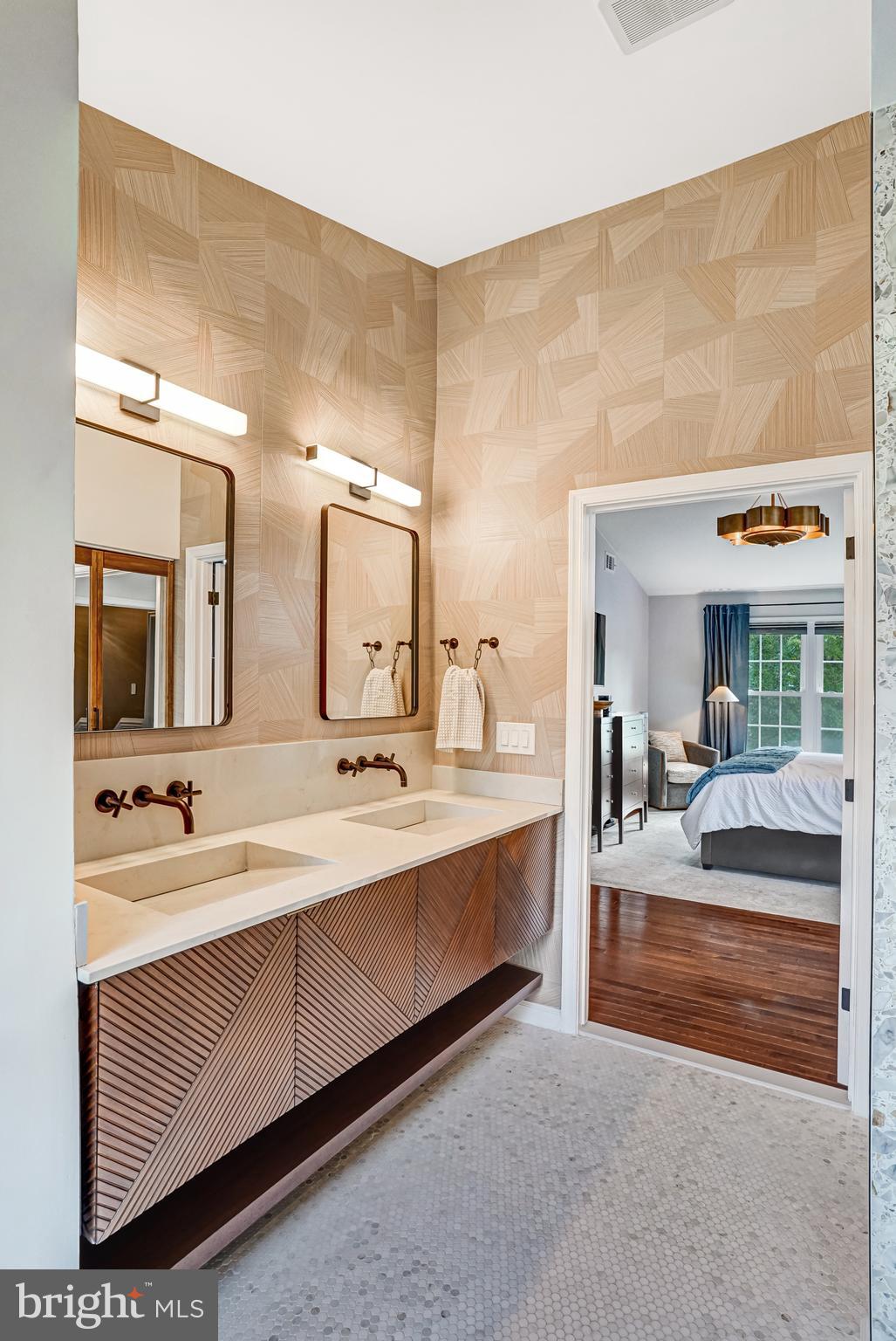 9009 Digory Court Burke, VA 22015 - Photo 7 of 51 a spacious bathroom with a double vanity sink and mirror
