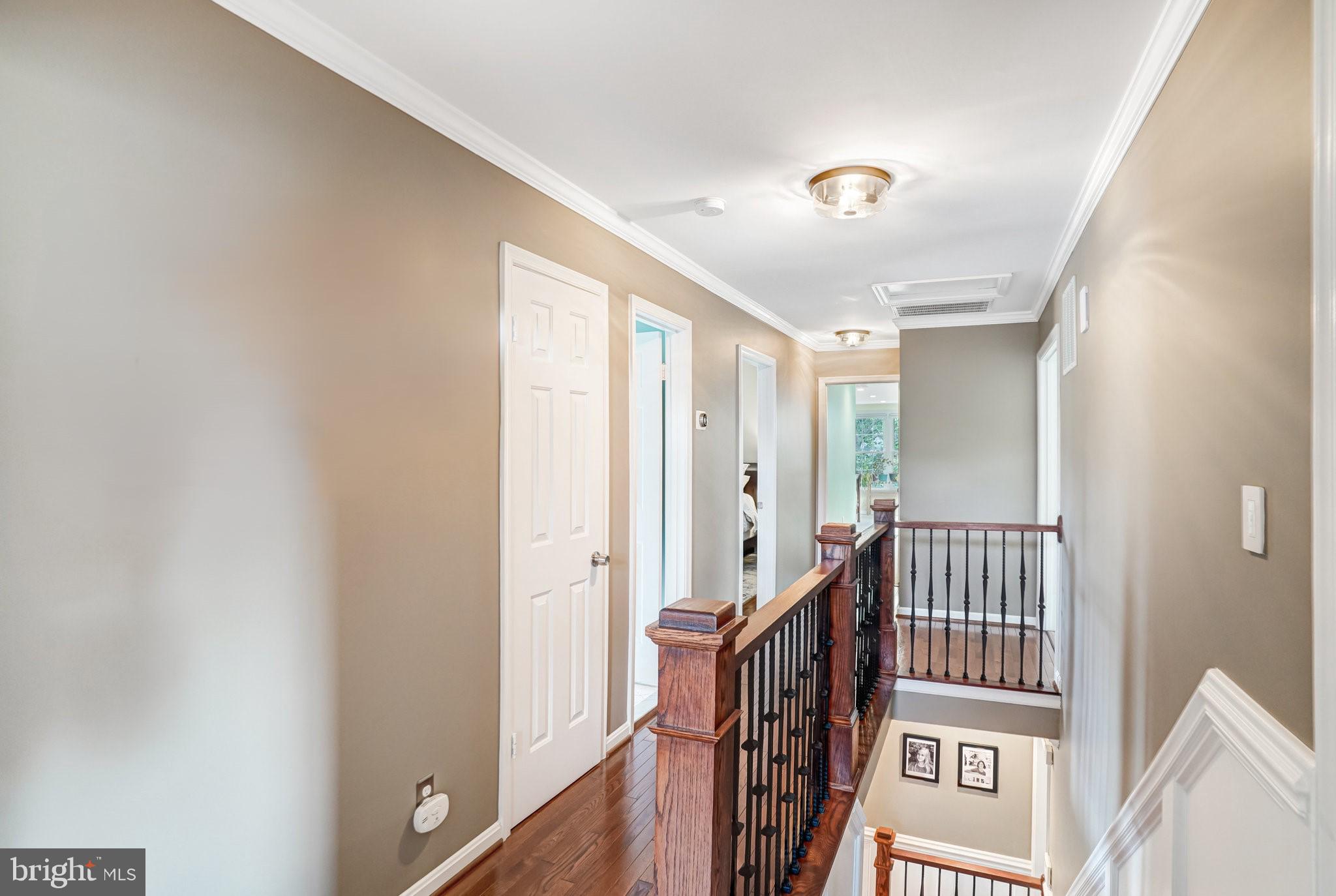 9009 Digory Court Burke, VA 22015 - Photo 8 of 51 a view of a hallway with windows and stairs