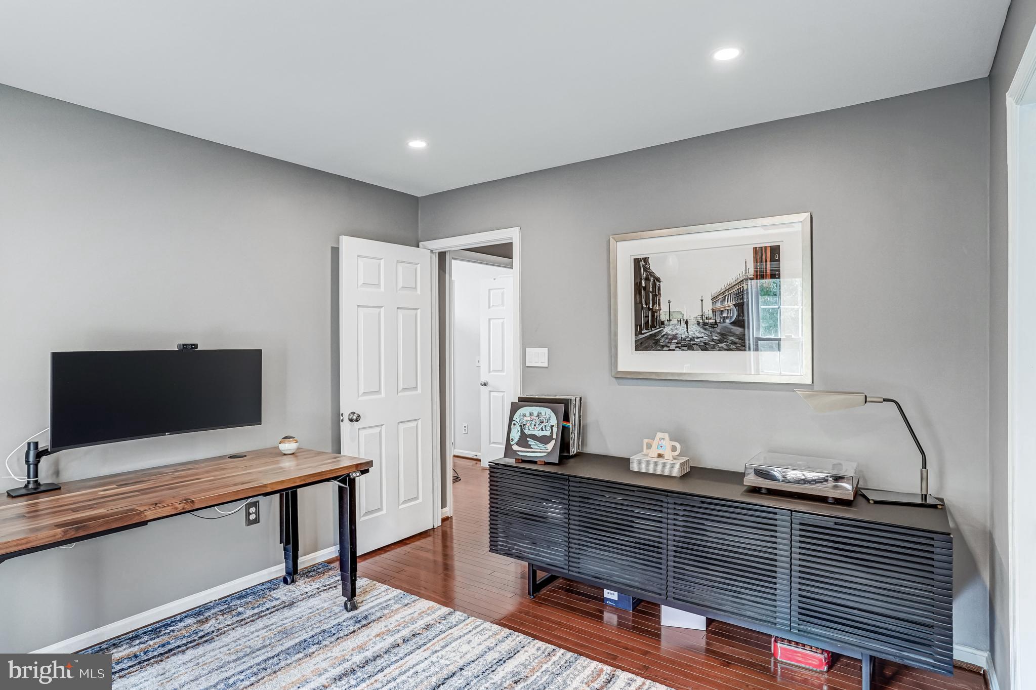 9009 Digory Court Burke, VA 22015 - Photo 10 of 51 a living room with furniture and a flat screen tv