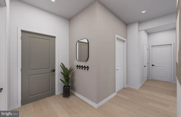 a bathroom with a toilet sink vanity and mirror