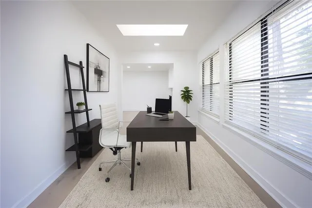 a view of a workspace with furniture