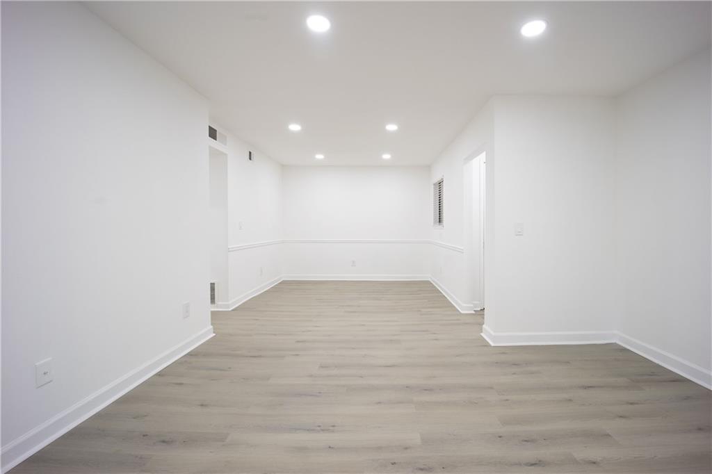 2712 Huntingdon Chase Atlanta, GA 30350 - Photo 14 of 27 a view of empty room with wooden floor