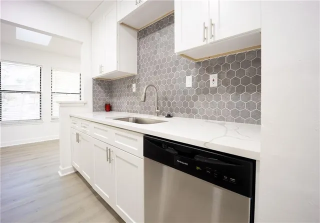 a close view of a sink and a mirror in a room
