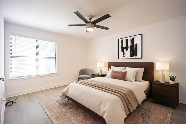 a bedroom with a bed and window