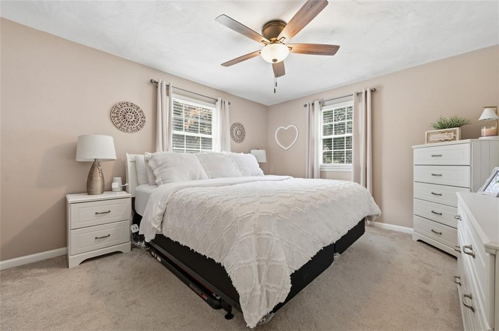 129 Meadowbrook Road Renfrew, PA 16053 - Photo 14 of 45 a spacious bedroom with a bed and a window