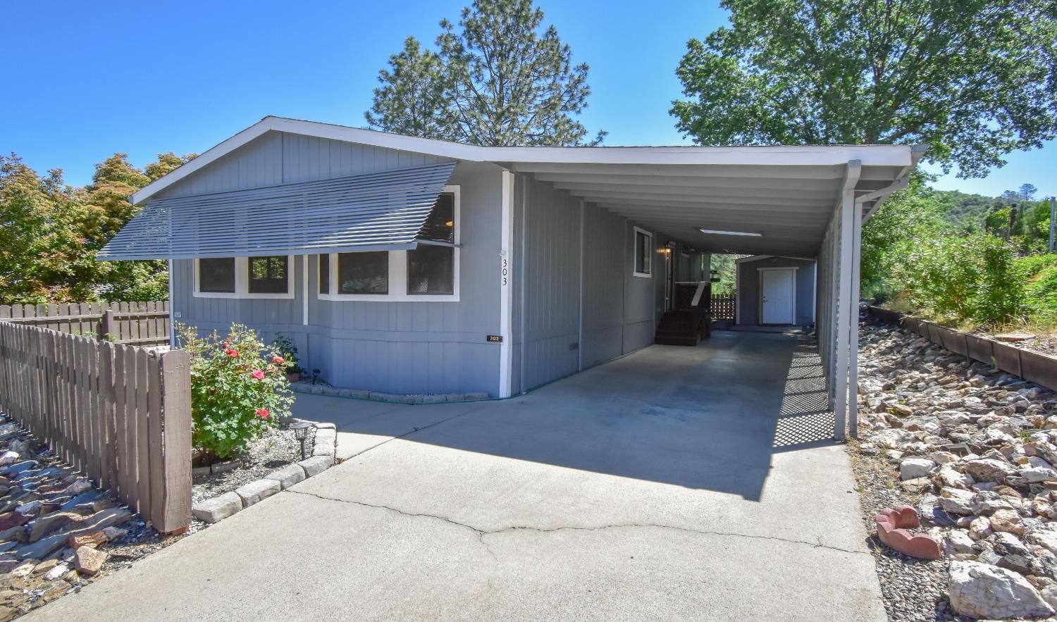 18717 Mill Villa Road, Unit 303 Jamestown, CA 95327 - Photo 1 of 1 a front view of a house with a yard