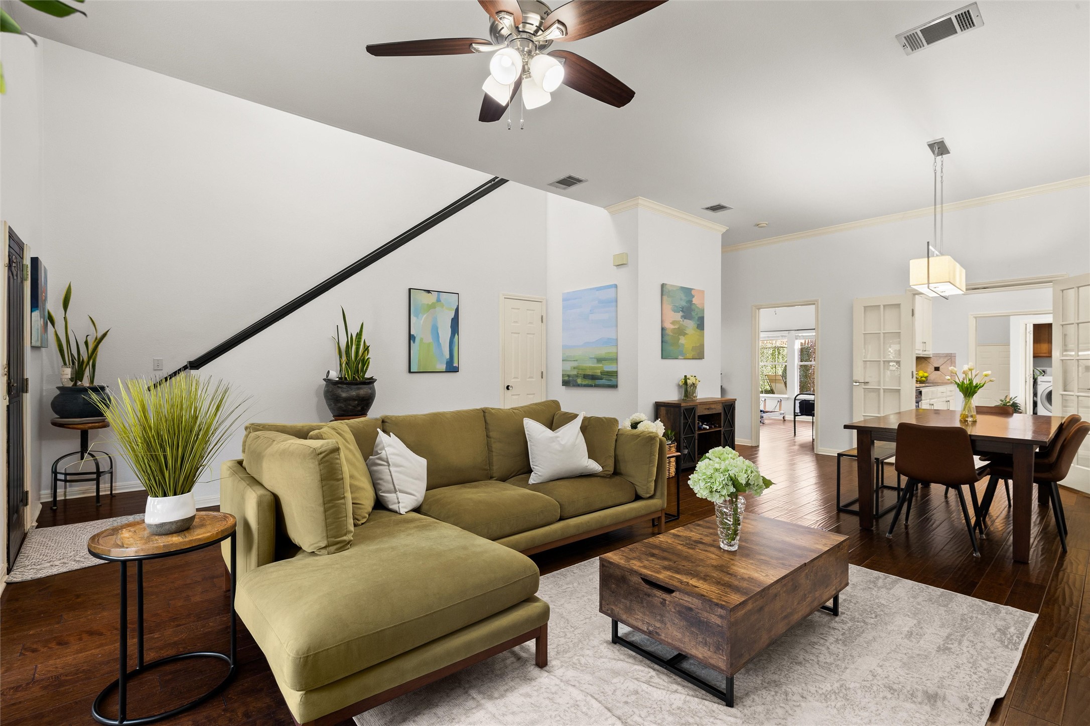 5515 Davis Lane, Unit 32 Austin, TX 78749 - Photo 11 of 40 a living room with furniture kitchen view and a chandelier