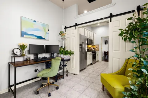 a workspace with furniture and potted plant