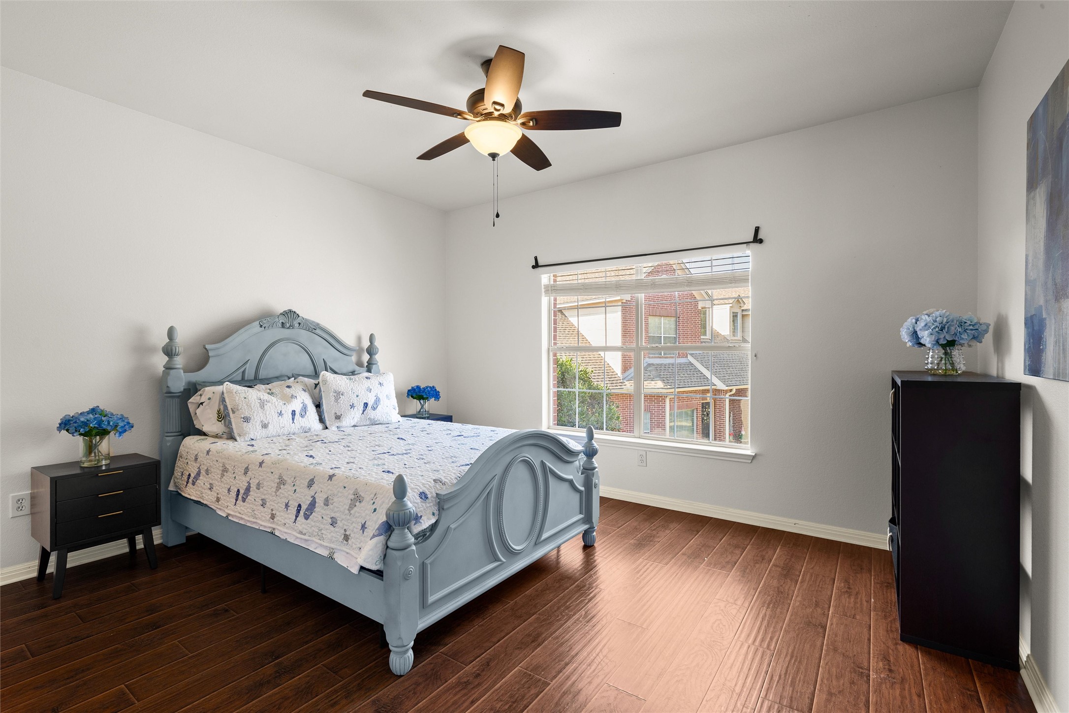 5515 Davis Lane, Unit 32 Austin, TX 78749 - Photo 25 of 40 a bedroom with a bed and wooden floor