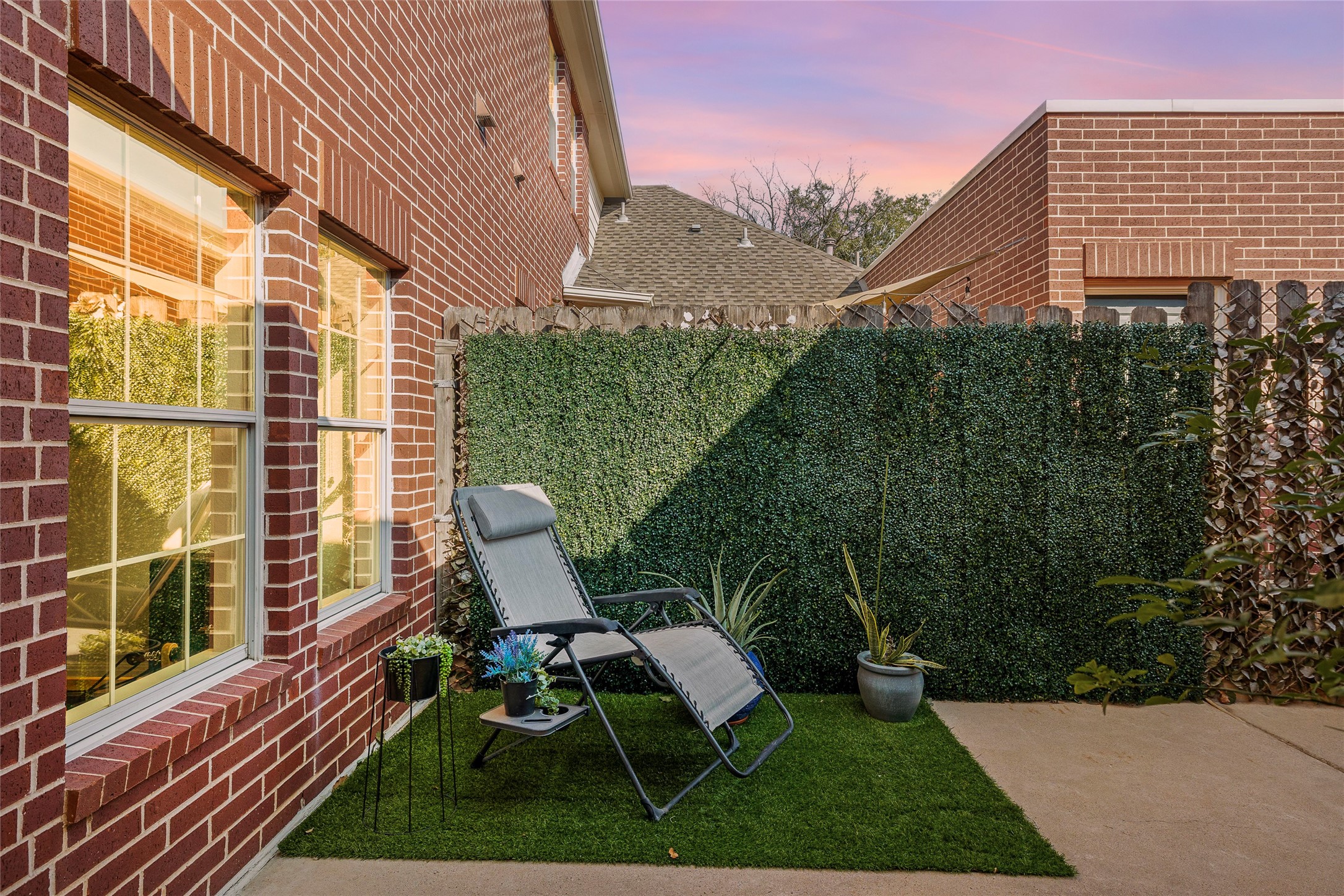 5515 Davis Lane, Unit 32 Austin, TX 78749 - Photo 28 of 40 a view of backyard with seating space and wooden fence