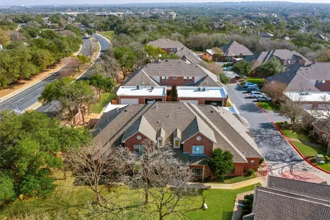 an aerial view of a house with a garden