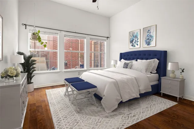 a spacious bedroom with a large bed and a window