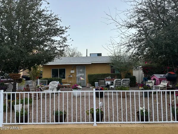 a view of outdoor space with deck and trees in the background