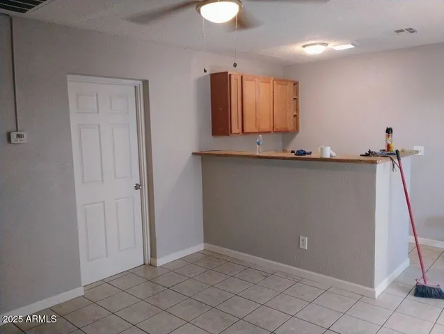 a view of a kitchen with electric appliances